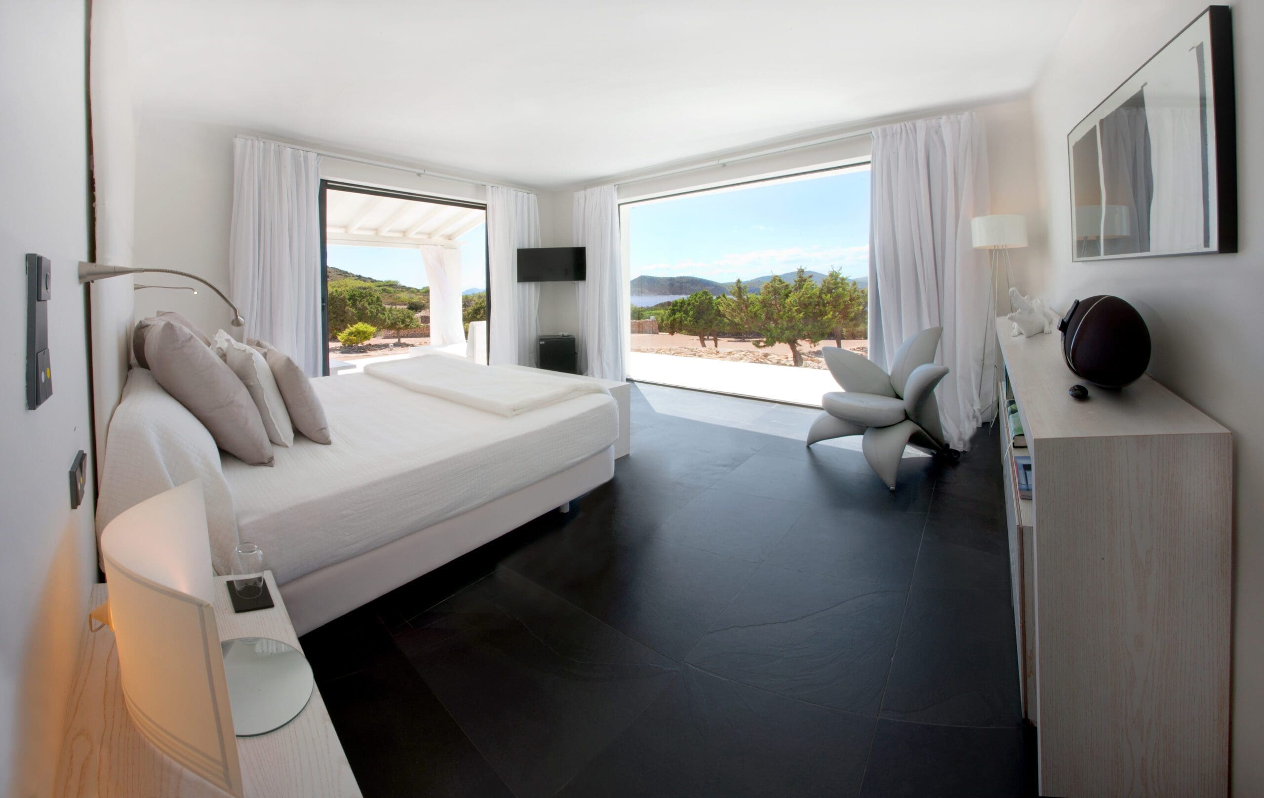 Tagomago bedroom with sea views through wide windows